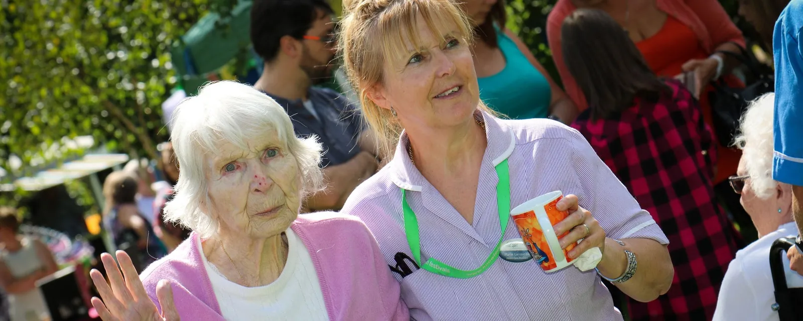 Laurel Care Home nurse with a resident in the garden